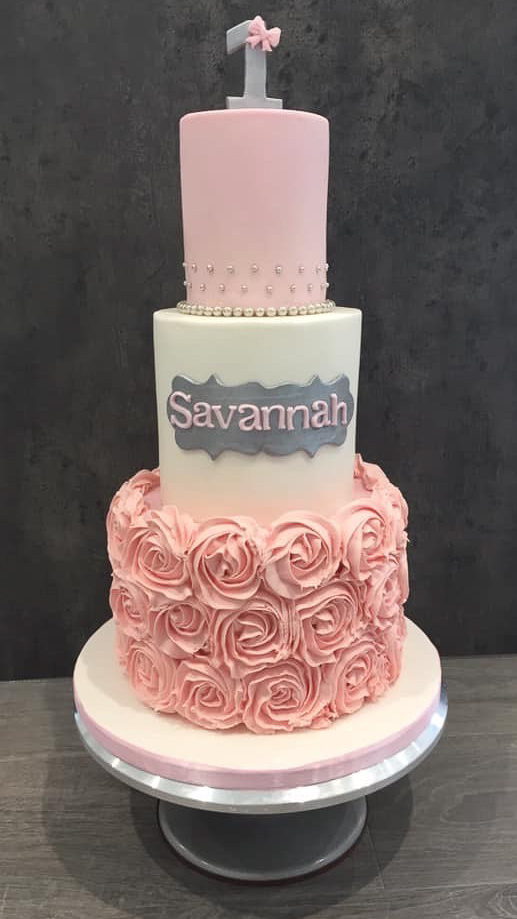 Luxury three-tier 1st Birthday cake with pink buttercream rosettes