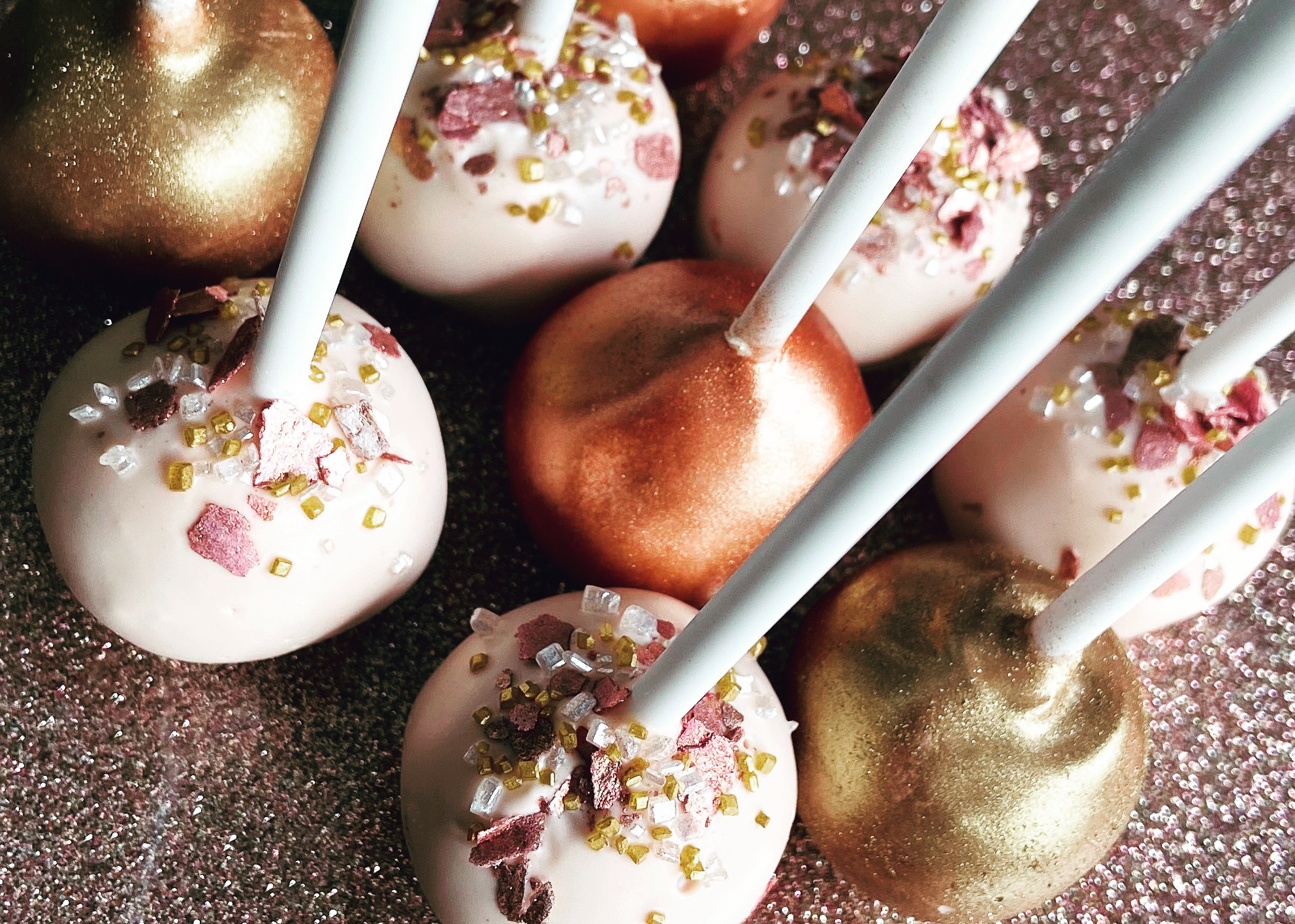 Pink and metallic cake pops